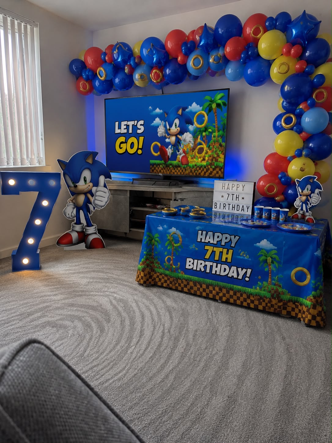 Sonic themed children's birthday party with balloon garland and decor